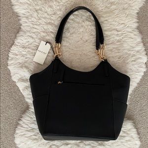 Good as new, black leather Kate and Alex Cuffaro bag.  Only used a couple times.